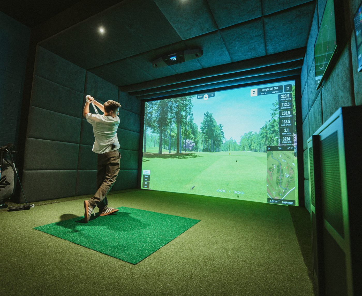 Golf simulator bay with Foresight Falcon setup