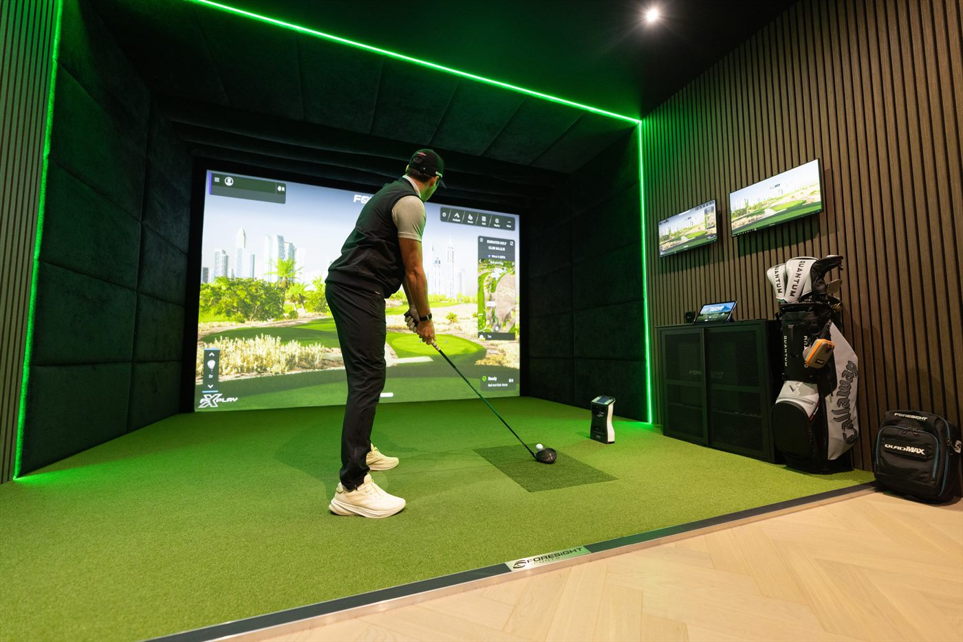 Indoor golf simulator player